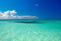 Cyan ocean under blue sky with clouds