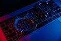 Cyber crime, online piracy and internet web hacking concept. Handcuffs on a keyboard Royalty Free Stock Photo