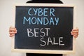 Cyber monday best sale written on blackboard. Black friday concept. Boy hold board