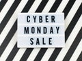Cyber Monday sale text on lightbox on striped background