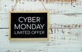 Cyber Monday typography text on wooden blackboard hanging on wooden background Royalty Free Stock Photo