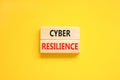 Cyber resilience symbol. Concept word Cyber resilience typed on wooden blocks. Beautiful yellow table yellow background. Business Royalty Free Stock Photo