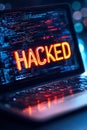 Cyber Security Breach Concept Laptop Screen with Neon HACKED Text on Programming Code Royalty Free Stock Photo