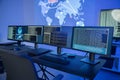 Cyber security command center with multiple monitors displaying data analysis and network information Royalty Free Stock Photo