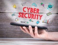 Cyber Security concept. Tablet computer in the hand. Old wooden background Royalty Free Stock Photo