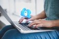 Cyber security concept. Woman using laptop. Cloud with padlock illustration over keyboard Royalty Free Stock Photo