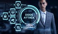 Cyber security data protection business technology privacy concept. Young businessman select the word Ddos attack on the virtual