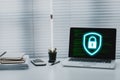 Cyber security, digital crime concept, Laptop computer on office desk with key icon on screen display, cybersecurity expert Royalty Free Stock Photo