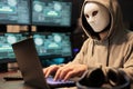 Cyber terrorist wearing mask and hood to hack computer