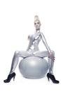 Cyber woman sitting on a silver ball Royalty Free Stock Photo