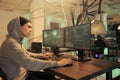 Cybercrime, asian hacker coding computer worm program, data breach Royalty Free Stock Photo