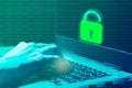 Cybercrime concepts The hacker's hand is on blurry computer or laptop background. Stolen data and use it for payments. Royalty Free Stock Photo