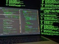 Cybercrime, hacking and technology concept. Hacker using malicious code or viraus program for anonymus cyber attack on database