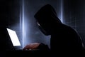 Cybercrime, hacking and technology crime. hacker with laptop