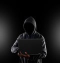 Cybercrime, hacking and technology crime. no face hacker with laptop