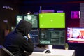 Cybercriminal coding on green screen PC, creating stealth malware Royalty Free Stock Photo