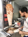 Kebab or shawarma is sold by hawkers in small roadside shops as a takeaway dish. Royalty Free Stock Photo