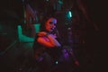 Cyberpunk female cosplay with neon lighting. A girl in a steampunk costume