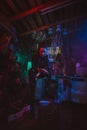 Cyberpunk girl in a post-apocalyptic futuristic style in a garage
