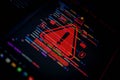 Cybersecurity breach warning with red alert symbol and System Hacked text over programming code, representing hacking, Royalty Free Stock Photo