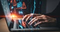 Cybersecurity concept with hacker hands typing on a laptop glowing with digital data and network connections Royalty Free Stock Photo