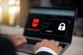 Cybersecurity concept with hacker icon and login screen on laptop