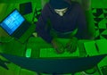 Cybersecurity, crime and man programming from above in neon office with code, fraud and hacking. Software, ransomware