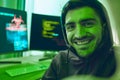 Cybersecurity, crime and smile, portrait of hacker in neon office with code, fraud and virus. Software, ransomware and