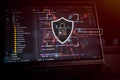 Cybersecurity and data protection concept with software source code on laptop screen, digital shield, password interface and Royalty Free Stock Photo