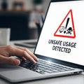 Cybersecurity and Data Risk Concept: A Person Using a Computer with an Unsafe Usage Warning on the Screen Royalty Free Stock Photo