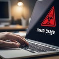Cybersecurity and Data Risk Concept: A Person Using a Computer with an Unsafe Usage Warning on the Screen Royalty Free Stock Photo
