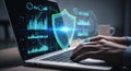 Cybersecurity shield protecting digital data on a laptop screen with analyst hands typing on keyboard Royalty Free Stock Photo