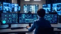 Cybersecurity Specialist Analyzing Data on Multiple Monitors in a Modern Office Environment Today Royalty Free Stock Photo
