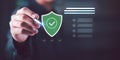 cybersecurity specialist verifies digital protection by selecting secure shield icon, representing data security, system Royalty Free Stock Photo