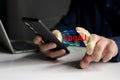 Cybersecurity threat from Log4J vulnerability on mobile device with binary code and warning interface Royalty Free Stock Photo