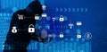 Cybersecurity vulnerability Log4J and hacker, coding, malware concept. Hooded computer hacker in cybersecurity vulnerability Log4J Royalty Free Stock Photo