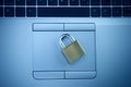 Cyberspace Security, Lock on Top of a Laptop Blue Toned Royalty Free Stock Photo