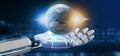 Cyborg hand holding a Earth globle particles 3d rendering Royalty Free Stock Photo