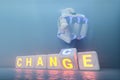 Cyborg robot hand changes text cube from change to chance - ai concept