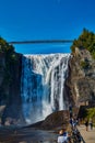 Cycilists at Bottom of Montmorency Falls Royalty Free Stock Photo