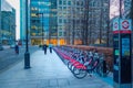 Cycle Hire docking station with Santander cycles aka Boris bikes in Canary Wharf. Royalty Free Stock Photo