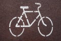 Cycle lane sign drawn in white on red Royalty Free Stock Photo