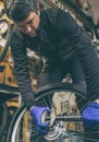 Cycle mechanist working on bike tires in workshop