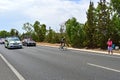 Cycle Racing A Rider Ahead Of The Team Cars Royalty Free Stock Photo