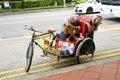 Cycle Rickshaw driver having a rest