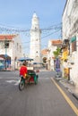 Cycle rickshaw is riding down the street, Penang, Malaysia