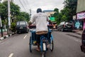 A trishaw driver at work on the Malioboro Street, Yogyakarta, Indonesia