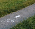 Cycle route from paving stones and grass