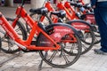 cycle stand with red colored smart bikes standing for rent showing this internet mobility startup providing eco friendly