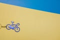 Cycle trinket miniature object on paper yellow blue textured background surface vintage style concept wallpaper sport activity Royalty Free Stock Photo